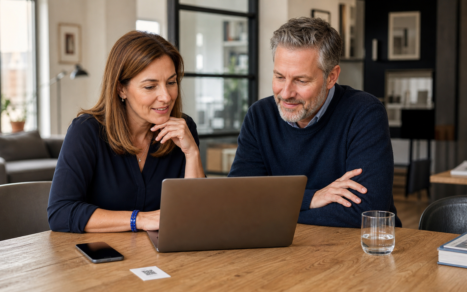 A consultant and advisor reviewing an AI business card together